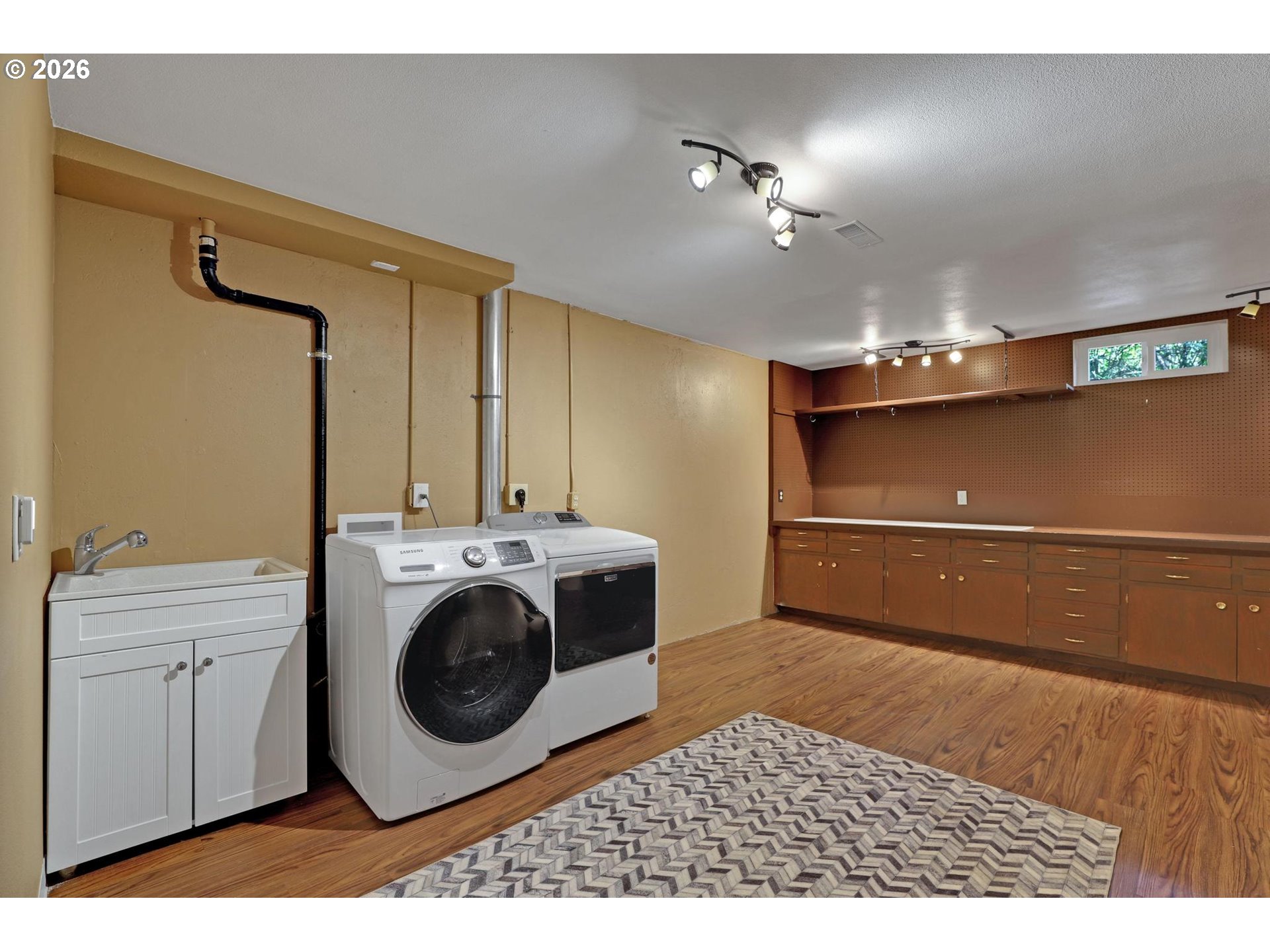 7021 Southwest Canyon Lane Portland, OR 97225 - Photo 19 of 25 a view of a storage & utility room with a washer dryer
