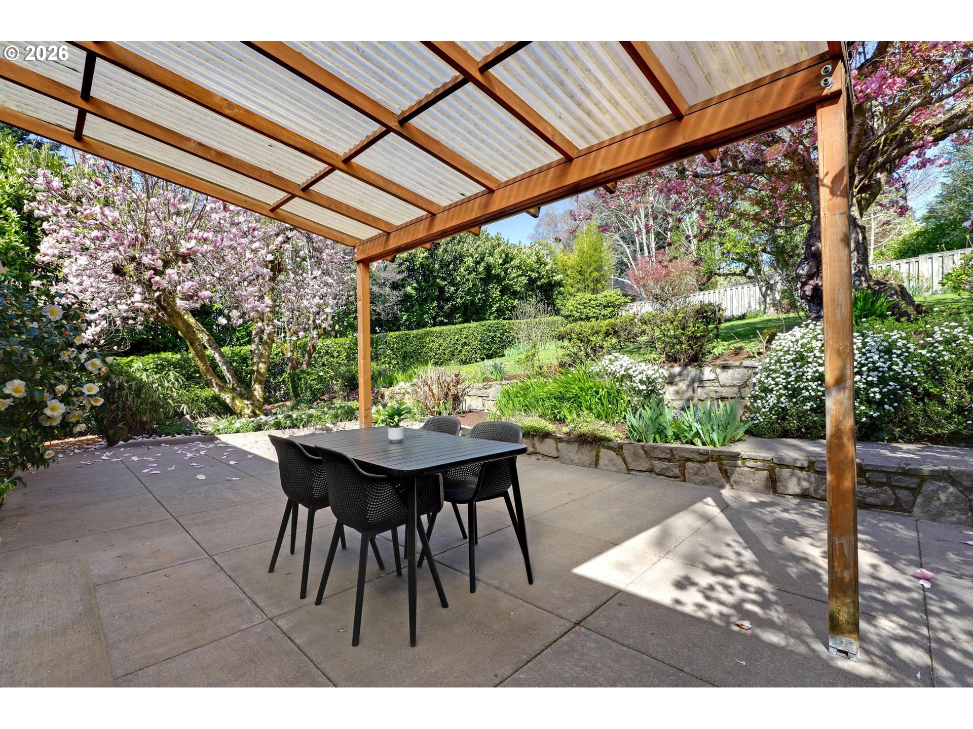 7021 Southwest Canyon Lane Portland, OR 97225 - Photo 23 of 25 a view of a patio with table and chairs and potted plants