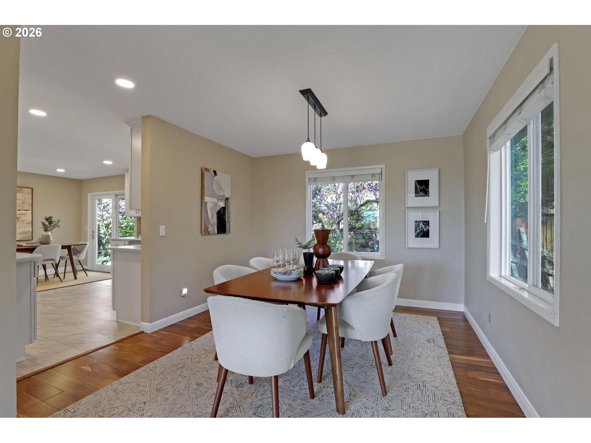 7021 Southwest Canyon Lane Portland, OR 97225 - Photo 6 of 25 a dining room with furniture a chandelier and wooden floor