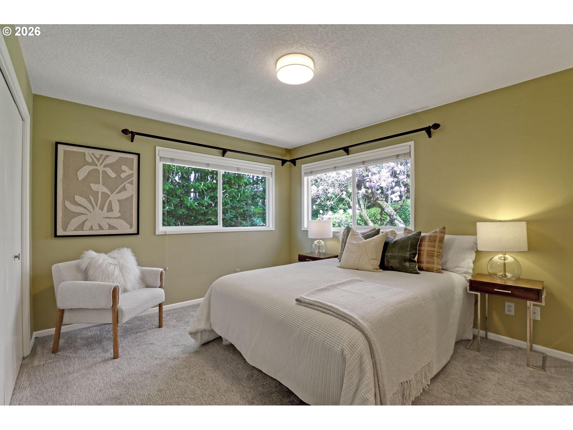 7021 Southwest Canyon Lane Portland, OR 97225 - Photo 10 of 25 a bedroom with a bed and a large window