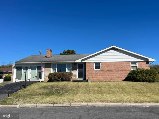 a front view of a house with yard
