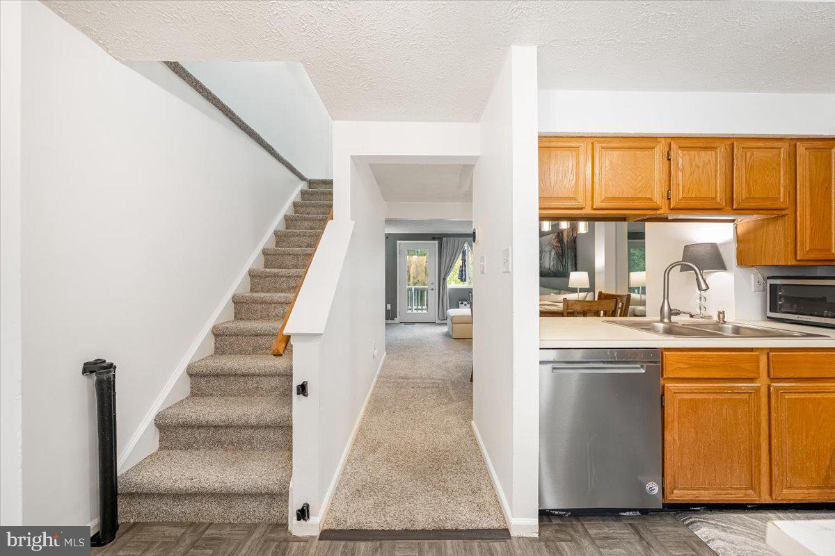 10109 Shelldrake Circle Damascus, MD 20872 - Photo 13 of 47 a view of a kitchen with furniture and staircase