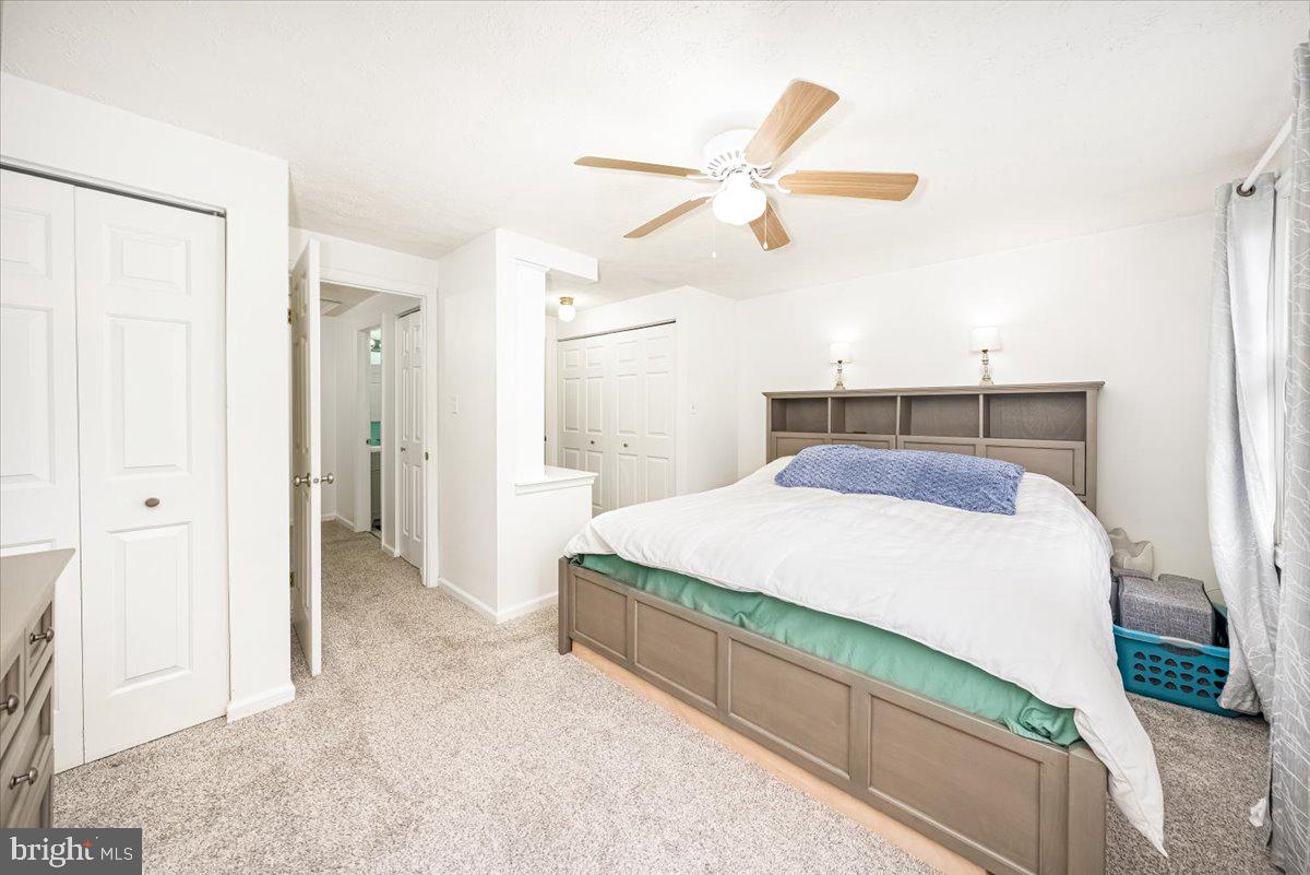 10109 Shelldrake Circle Damascus, MD 20872 - Photo 24 of 47 a bedroom with a bed and a chandelier