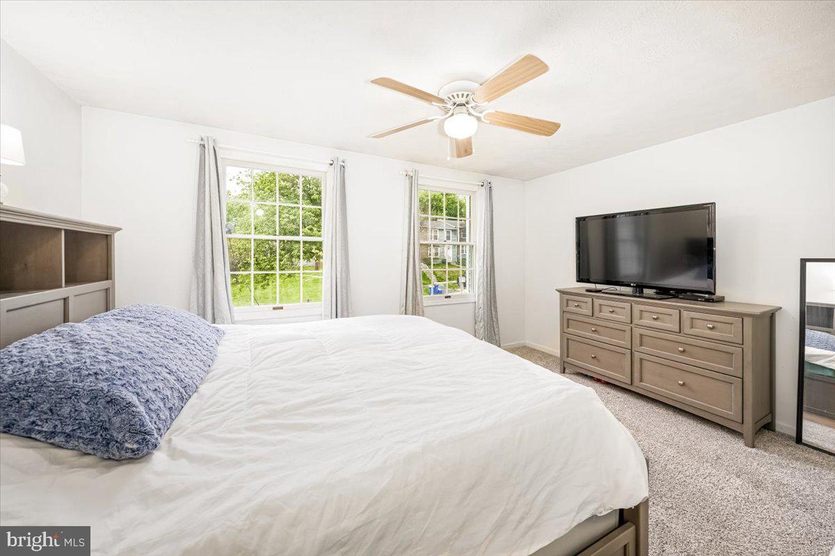 10109 Shelldrake Circle Damascus, MD 20872 - Photo 25 of 47 a bedroom with a bed and a flat screen tv