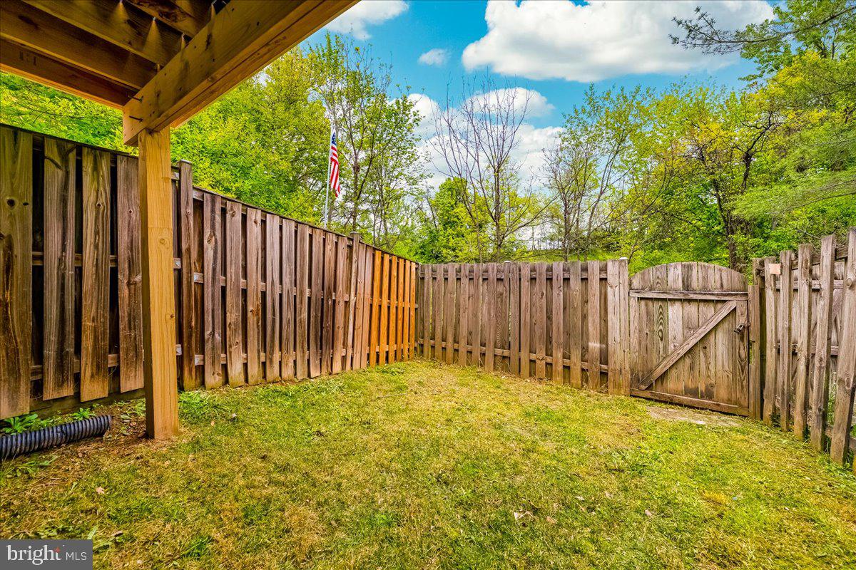 10109 Shelldrake Circle Damascus, MD 20872 - Photo 35 of 47 a view of small yard with wooden fence