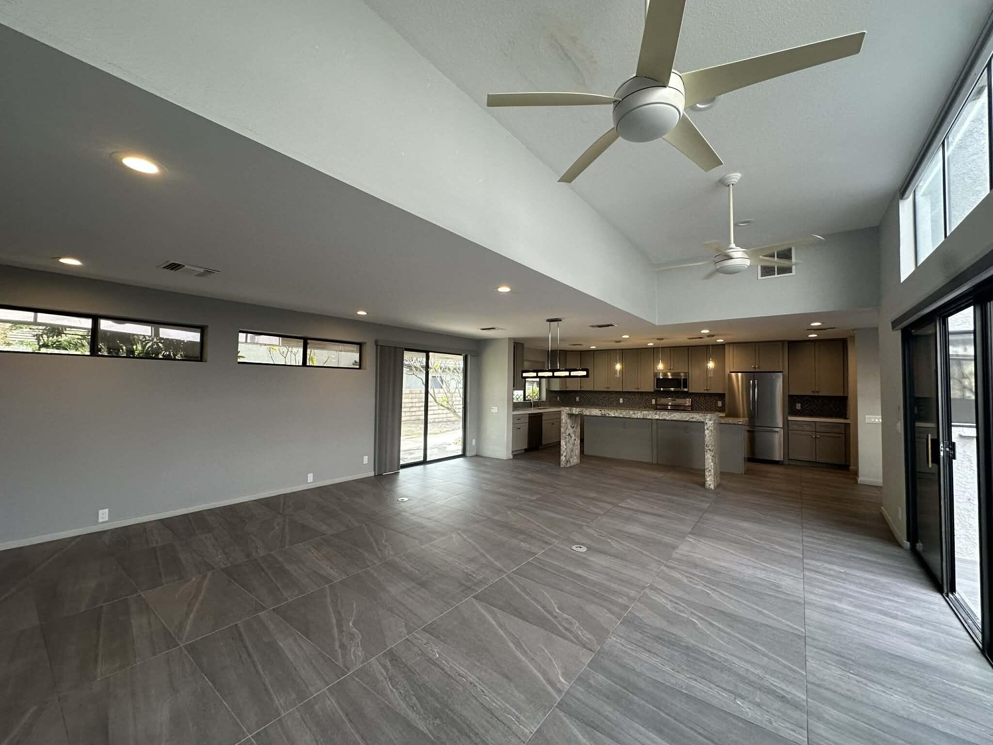 4 Saturn Circle Rancho Mirage, CA 92270 - Photo 11 of 32 a view of an empty room with kitchen and a window