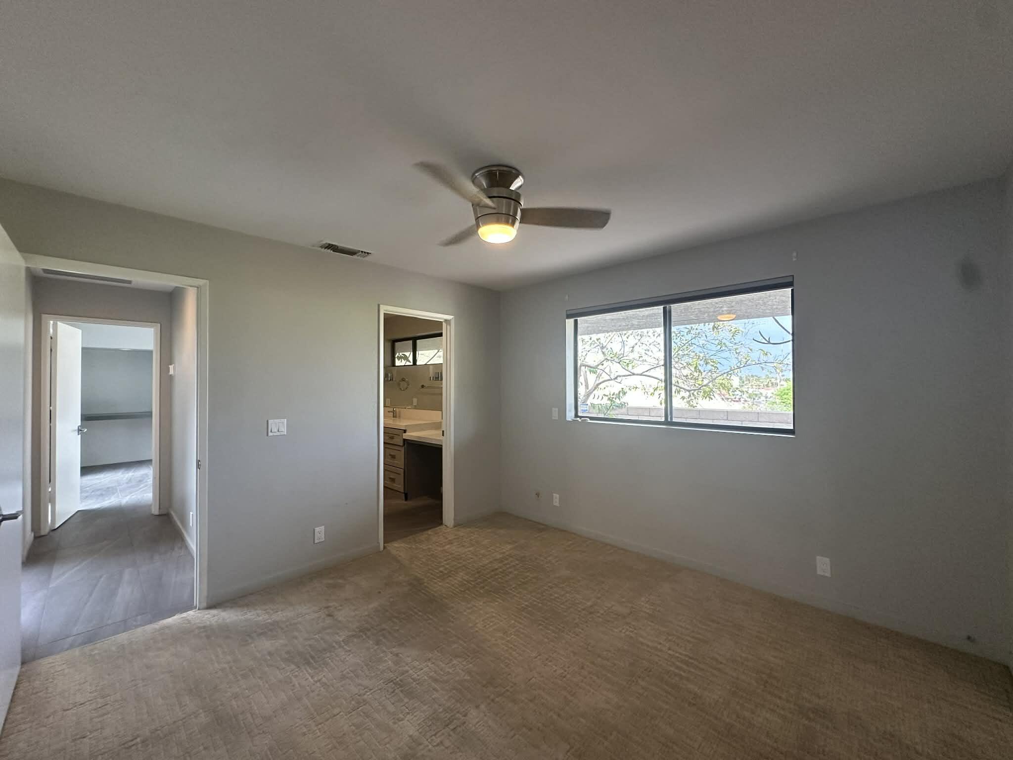 4 Saturn Circle Rancho Mirage, CA 92270 - Photo 13 of 32 an empty room with closet and windows