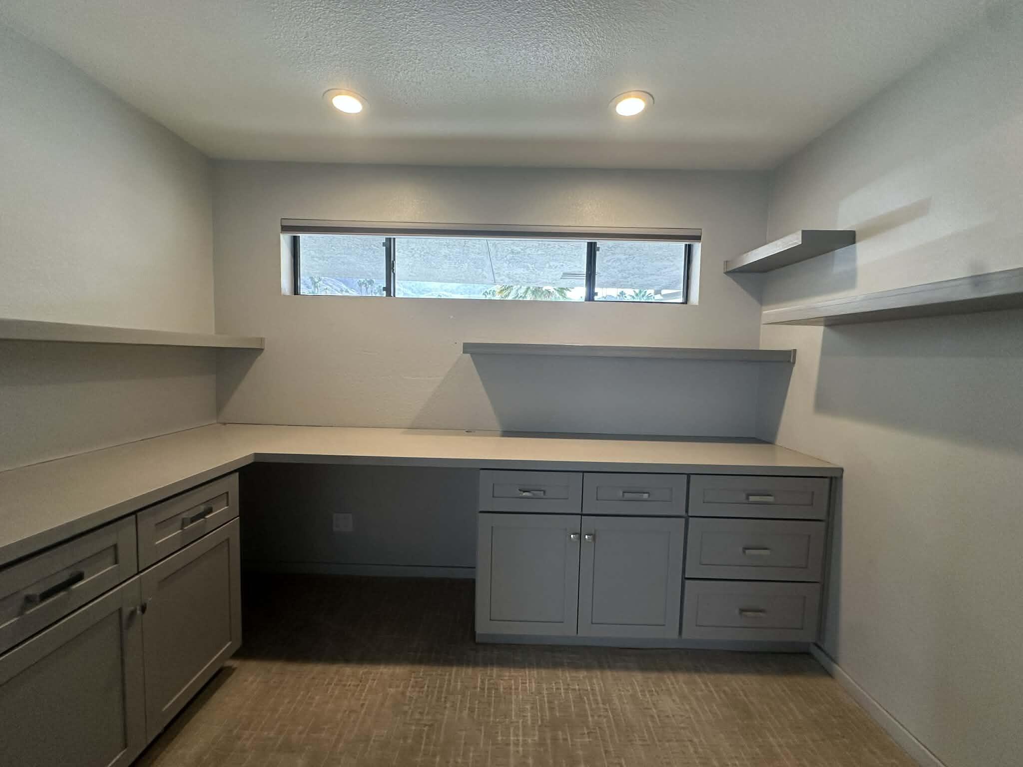4 Saturn Circle Rancho Mirage, CA 92270 - Photo 21 of 32 a hallway with cabinets