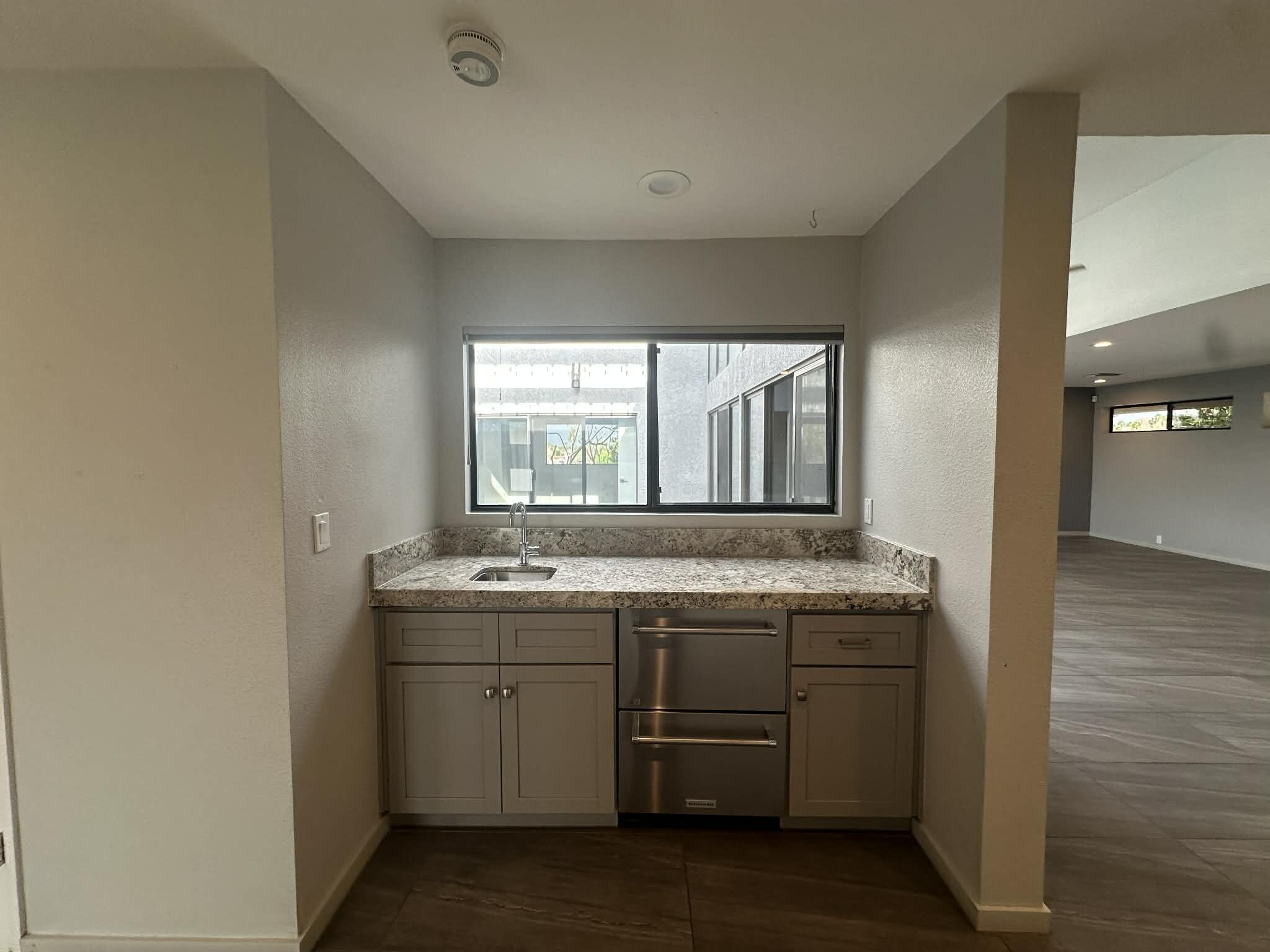 4 Saturn Circle Rancho Mirage, CA 92270 - Photo 7 of 32 a bathroom with a granite countertop sink and a mirror