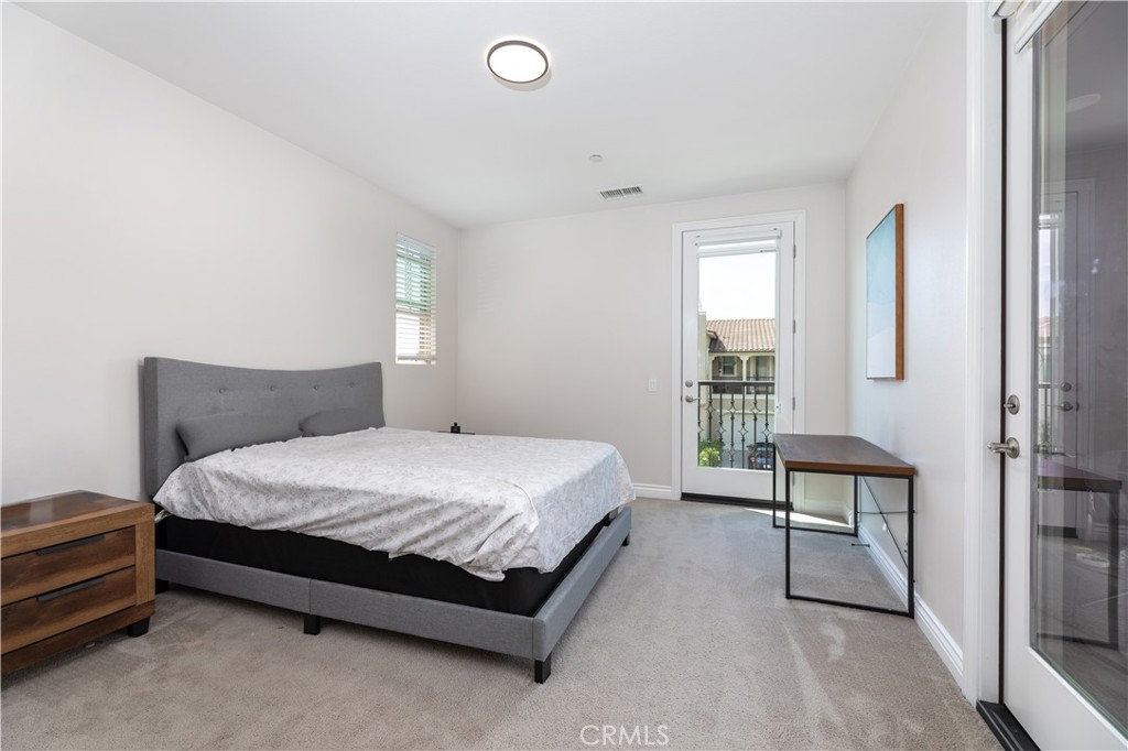 60 Gainsboro Irvine, CA 92620 - Photo 13 of 34 a spacious bedroom with a bed and a window