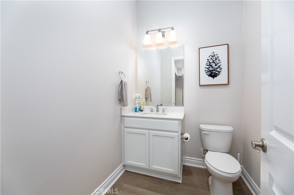 60 Gainsboro Irvine, CA 92620 - Photo 21 of 34 a bathroom with a toilet a sink and mirror