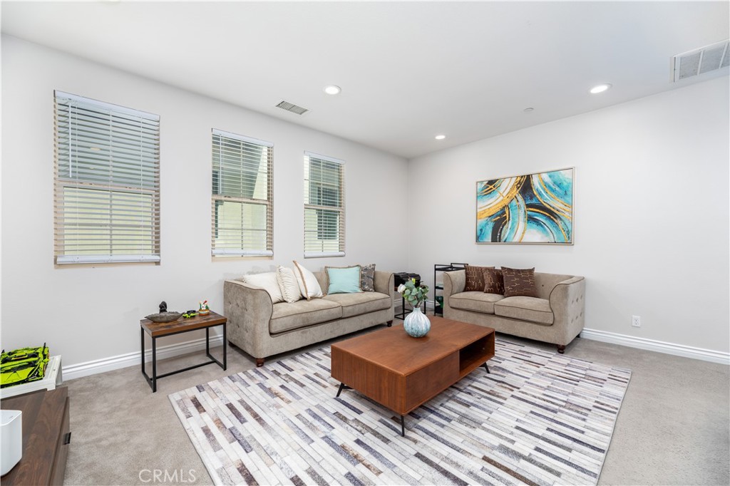 60 Gainsboro Irvine, CA 92620 - Photo 23 of 34 a living room with furniture and painting on the wall