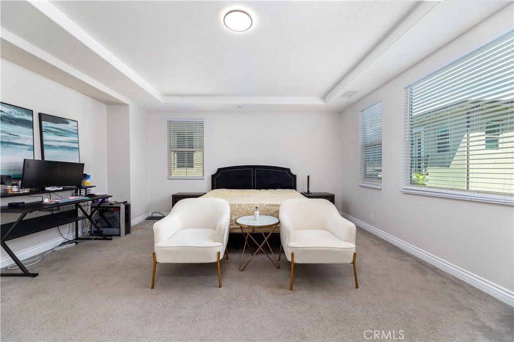 60 Gainsboro Irvine, CA 92620 - Photo 24 of 34 a bedroom with a bed and a chair