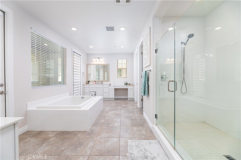 60 Gainsboro Irvine, CA 92620 - Photo 25 of 34 a large spacious bathroom with a tub shower and windows