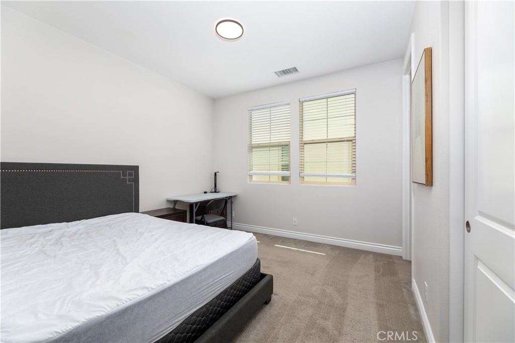 60 Gainsboro Irvine, CA 92620 - Photo 29 of 34 a bedroom with a bed and a window