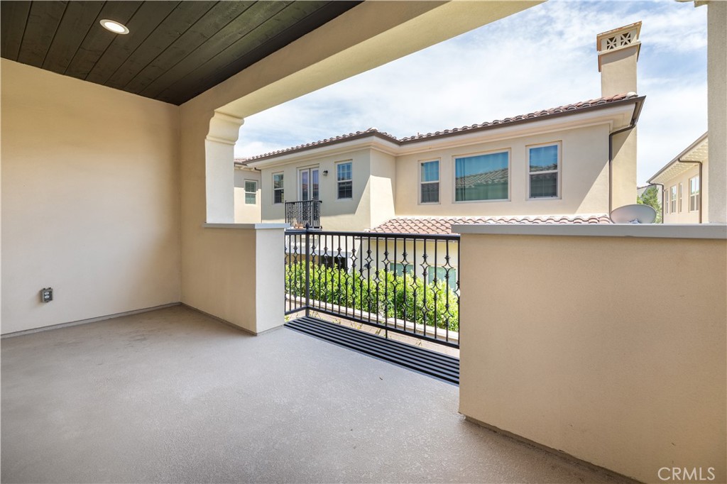60 Gainsboro Irvine, CA 92620 - Photo 31 of 34 a view of a house with porch and wooden floor