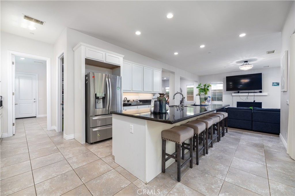 60 Gainsboro Irvine, CA 92620 - Photo 5 of 34 a kitchen with stainless steel appliances granite countertop a refrigerator and a stove top oven