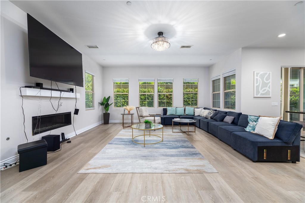 60 Gainsboro Irvine, CA 92620 - Photo 7 of 34 a living room with fireplace furniture and a flat screen tv