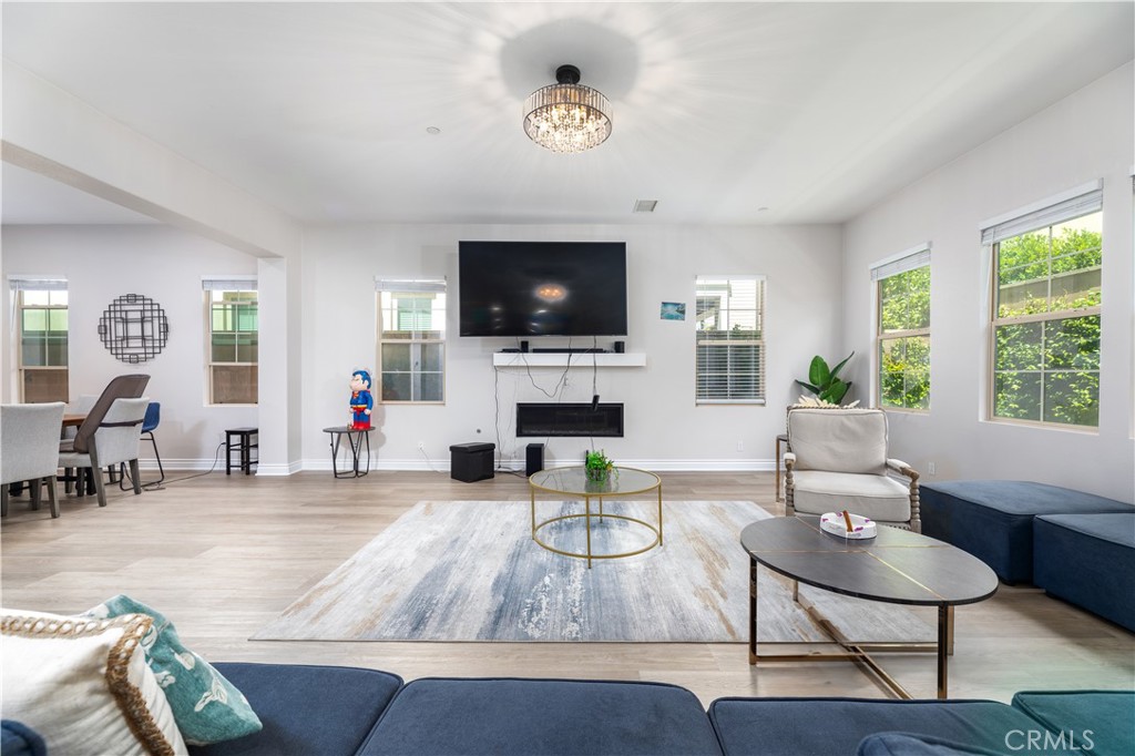 60 Gainsboro Irvine, CA 92620 - Photo 9 of 34 a living room with furniture a fireplace and a flat screen tv