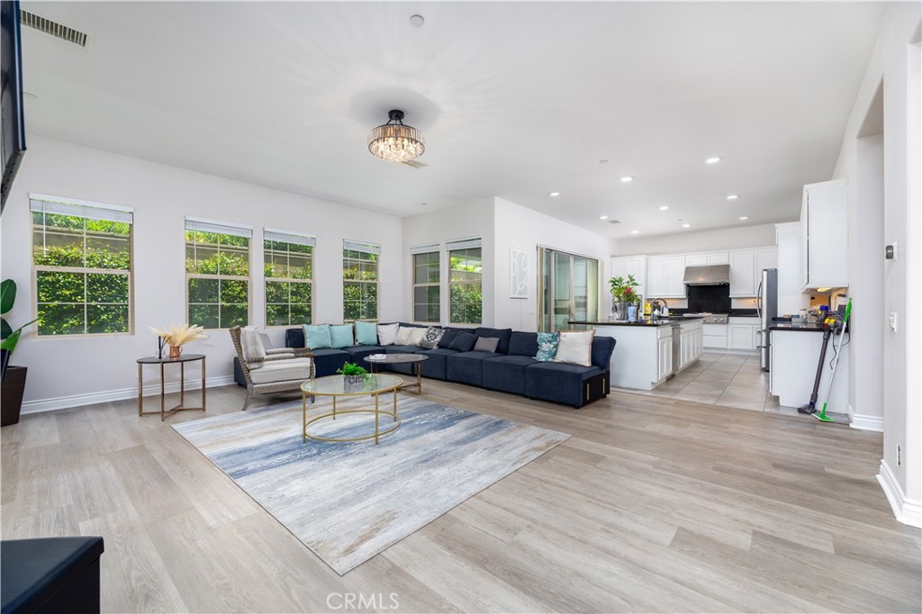 60 Gainsboro Irvine, CA 92620 - Photo 10 of 34 a living room with furniture kitchen view and a large window