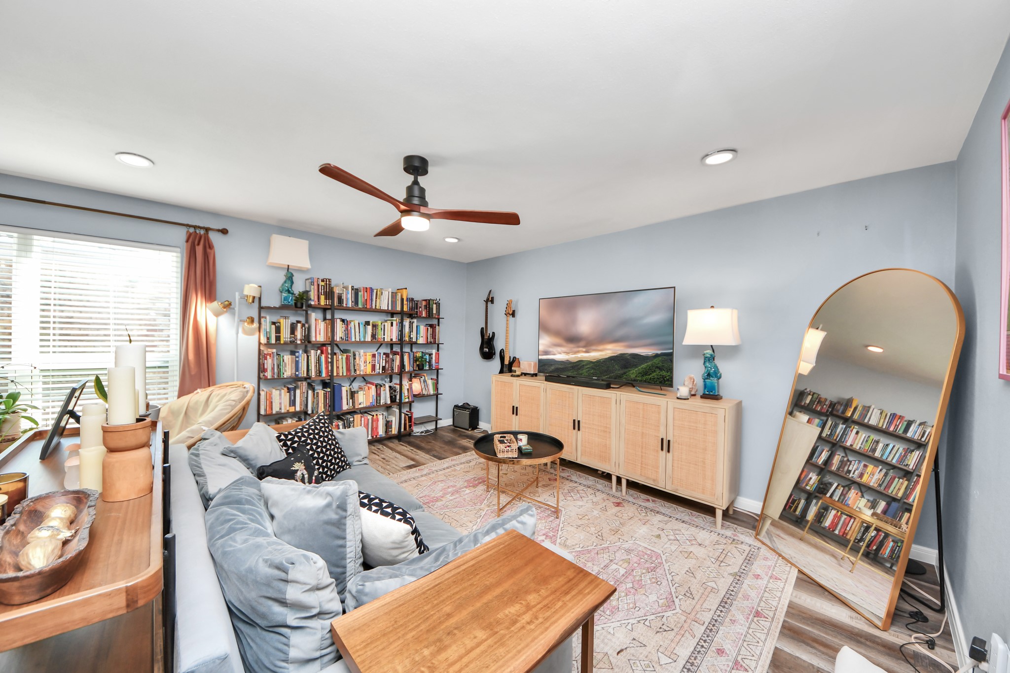 3224 Timmons Lane, Unit 168 Houston, TX 77027 - Photo 9 of 36 a living room with furniture and a flat screen tv