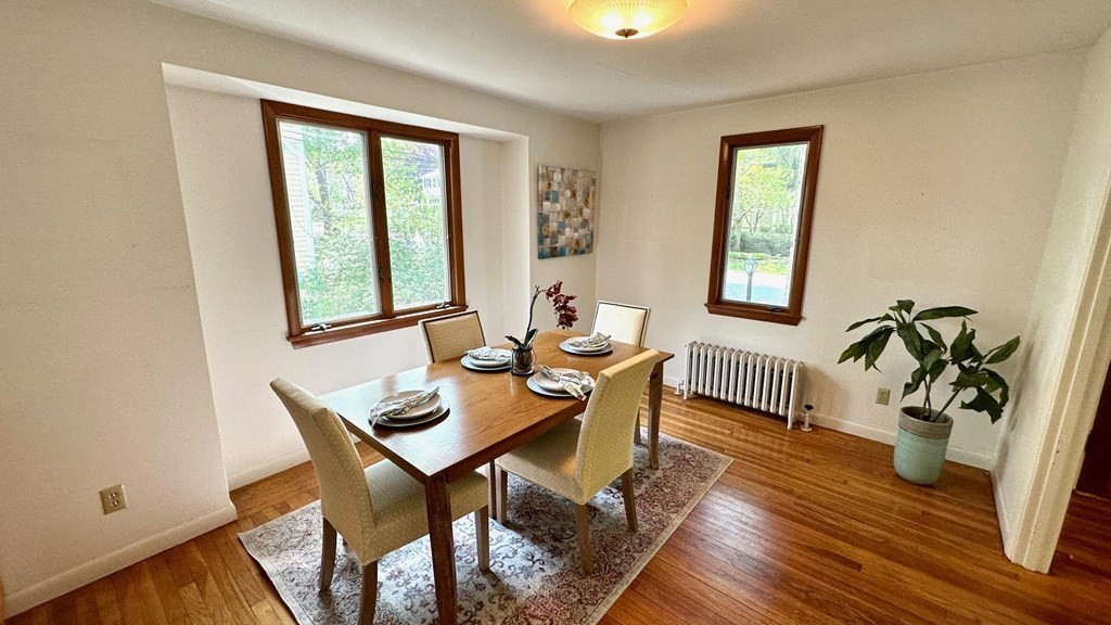 71 Reed Street Lexington, MA 02421 - Photo 2 of 6 a view of a dining room with furniture window and wooden floor