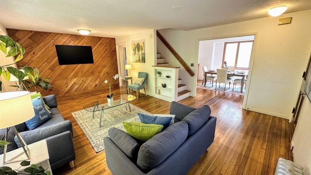 71 Reed Street Lexington, MA 02421 - Photo 3 of 6 a living room with furniture and a flat screen tv