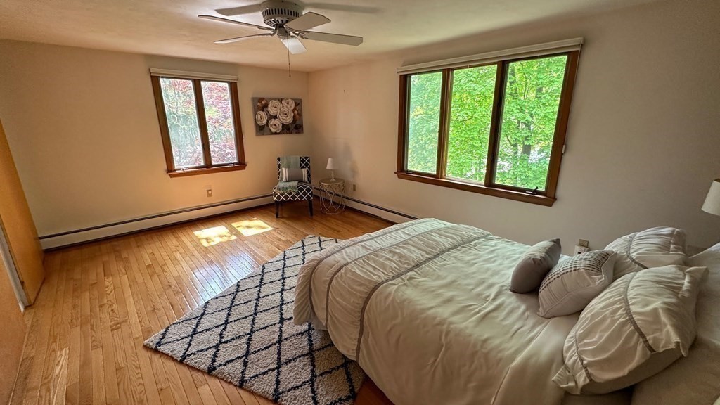 71 Reed Street Lexington, MA 02421 - Photo 5 of 6 a bedroom with a bed and a window