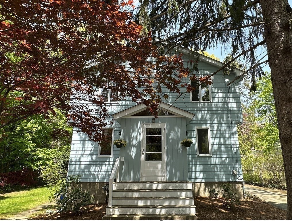 71 Reed Street Lexington, MA 02421 - Photo 6 of 6 a front view of a house with garden