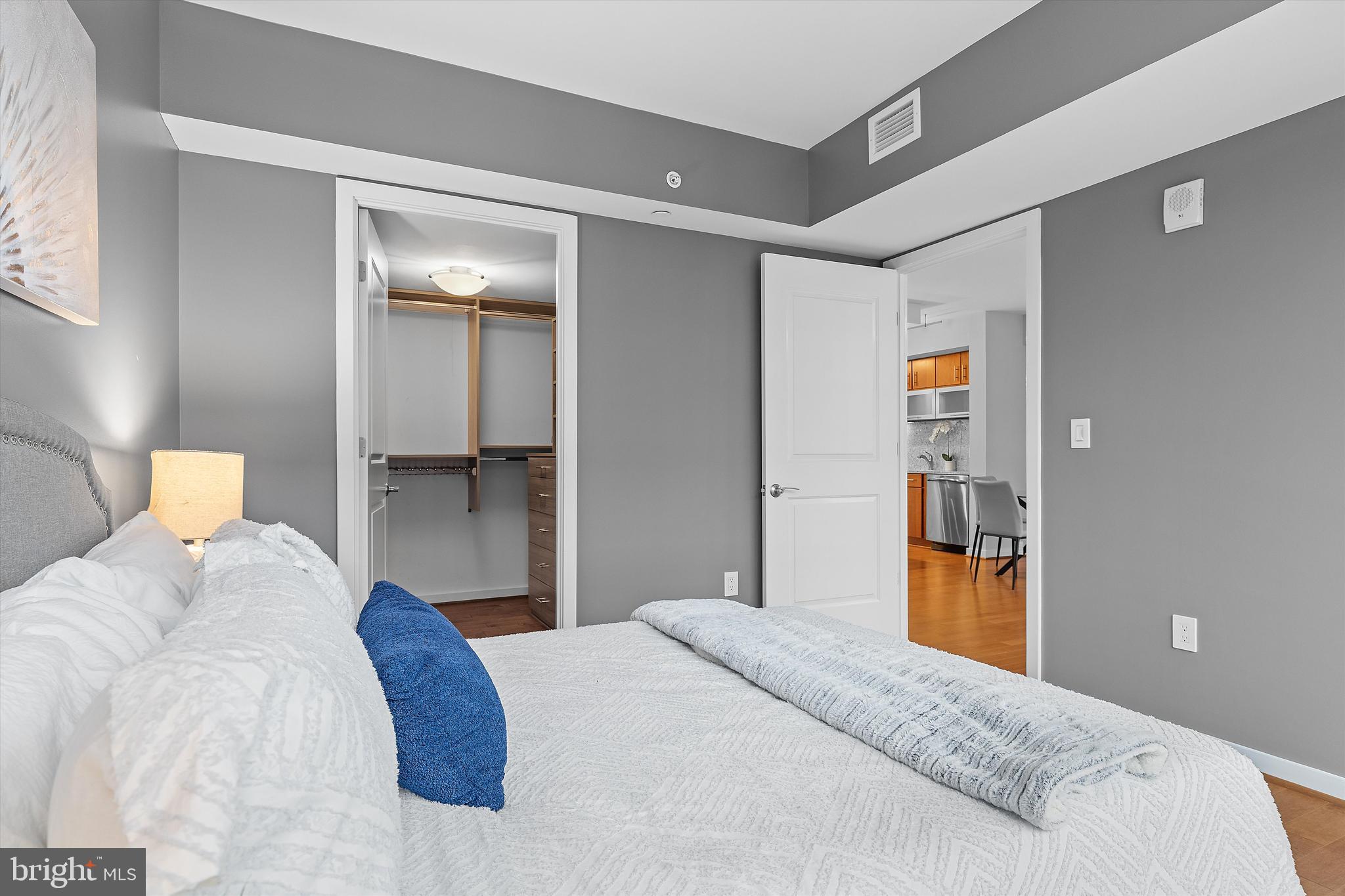 1025 First Street Southeast, Unit 1114 Washington, DC 20003 - Photo 14 of 23 a bedroom with a bed and a cabinets