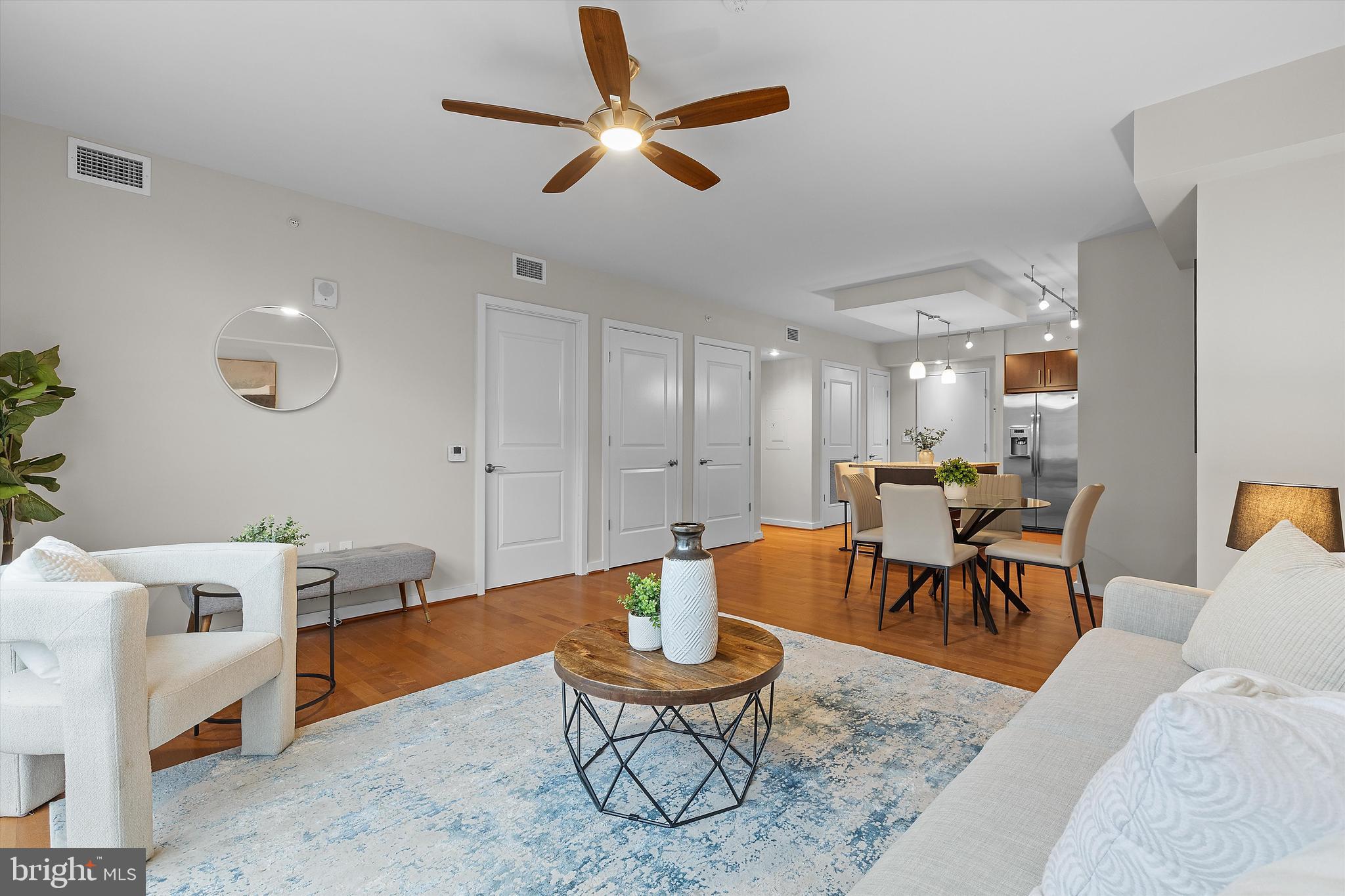 1025 First Street Southeast, Unit 1114 Washington, DC 20003 - Photo 9 of 23 a living room with furniture and a wooden floor