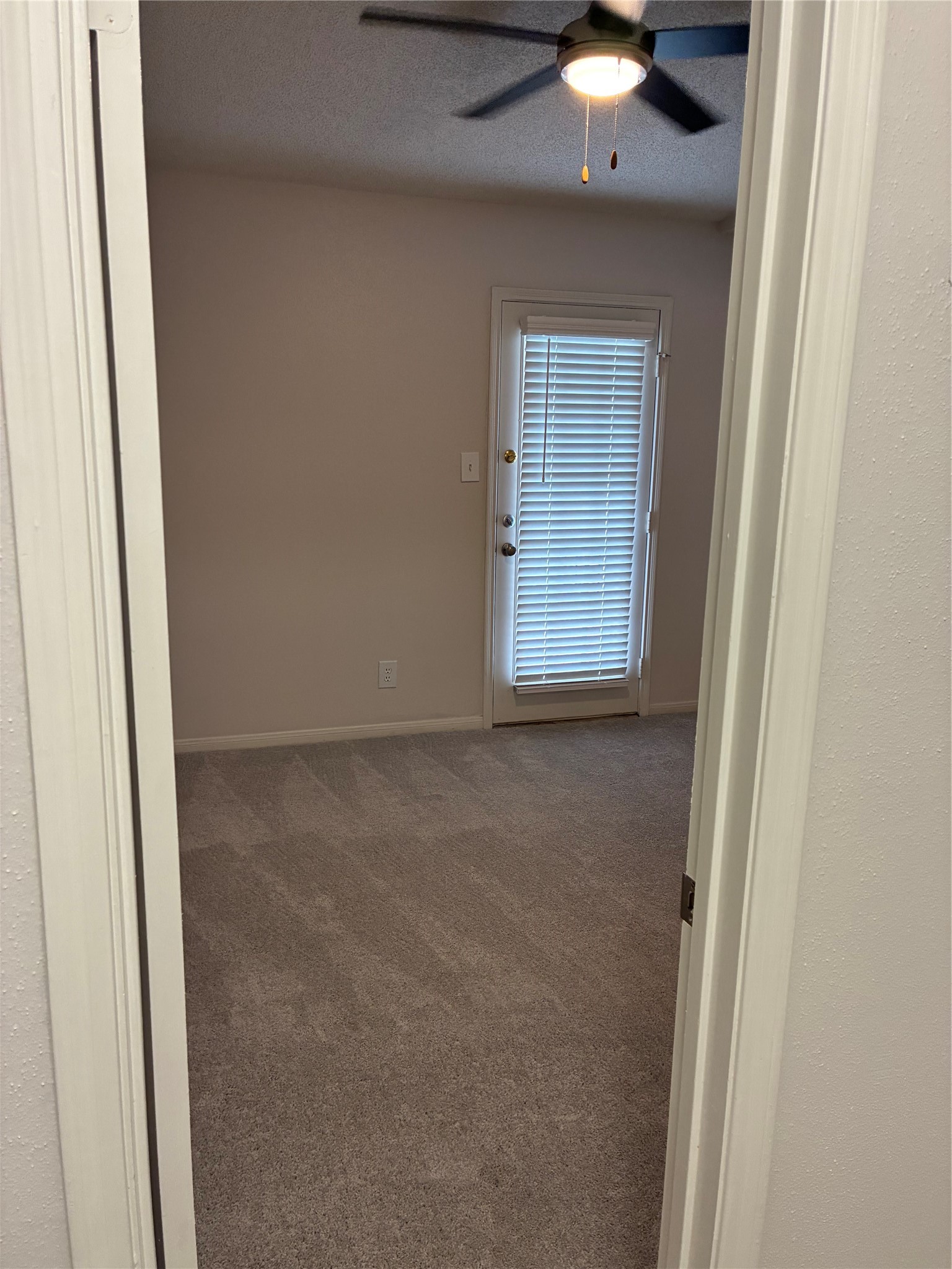 2121 Hepburn Street, Unit 404 Houston, TX 77054 - Photo 17 of 30 a view of an empty room with a chandelier fan and a window