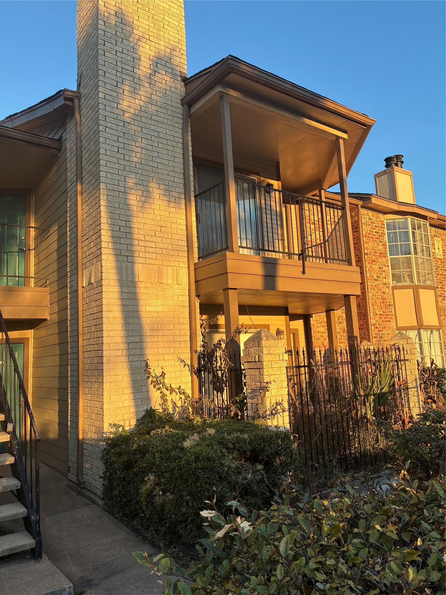 2121 Hepburn Street, Unit 404 Houston, TX 77054 - Photo 2 of 30 a view of a blue house with a yard