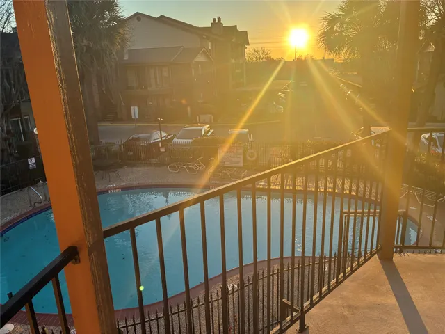 a view of balcony with wooden floor