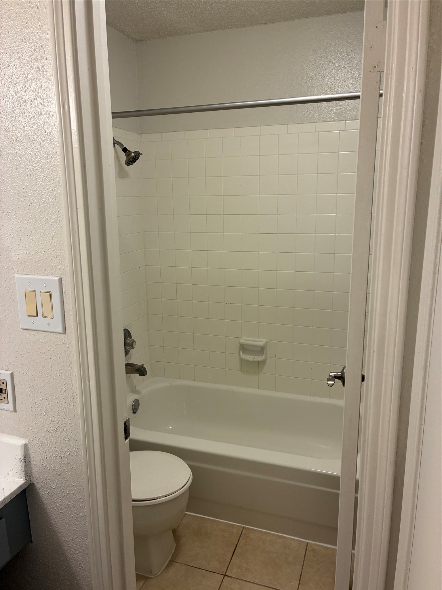 2121 Hepburn Street, Unit 404 Houston, TX 77054 - Photo 25 of 30 a bathroom with a shower a toilet and a sink
