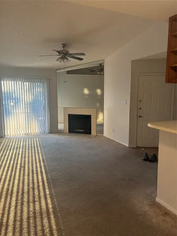 a view of empty room with fireplace