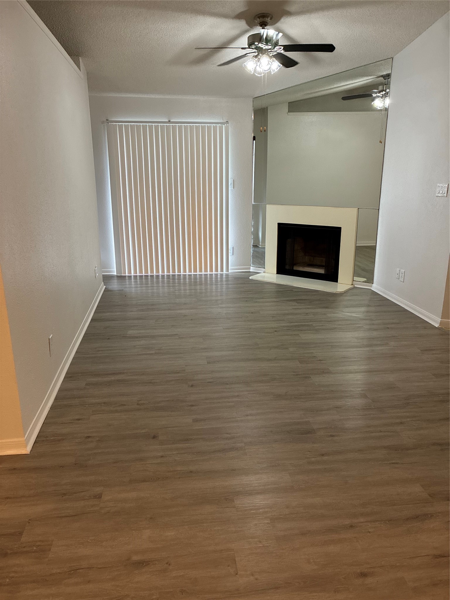 2121 Hepburn Street, Unit 404 Houston, TX 77054 - Photo 7 of 30 a view of an empty room with wooden floor and a window