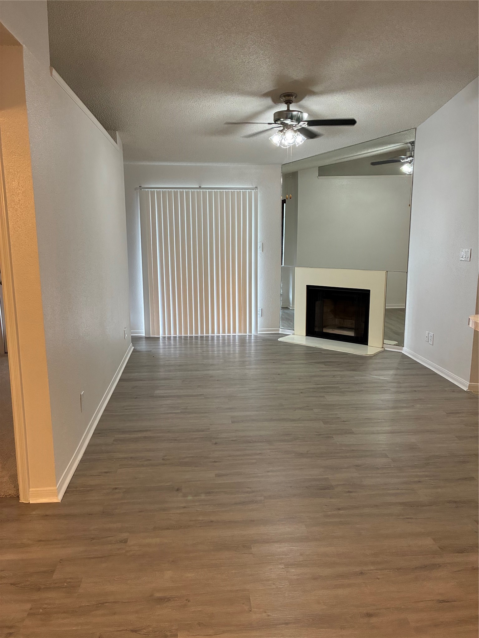 2121 Hepburn Street, Unit 404 Houston, TX 77054 - Photo 8 of 30 a view of an empty room with wooden floor and a window