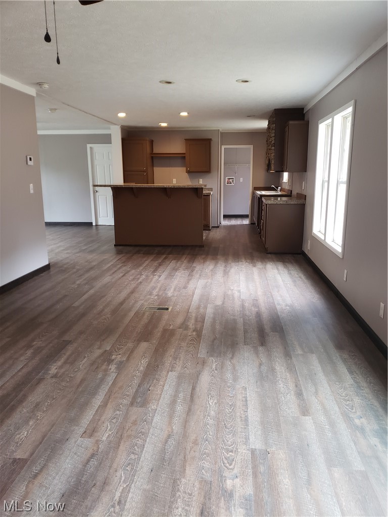2768 Liverpool Road Le Roy, WV 25252 - Photo 5 of 18 Unfurnished living room with dark wood-type flooring and ornamental molding
