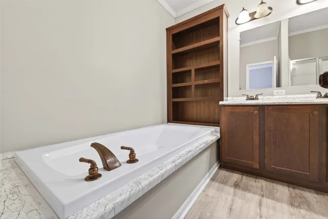 a bathroom with a bathtub and a sink