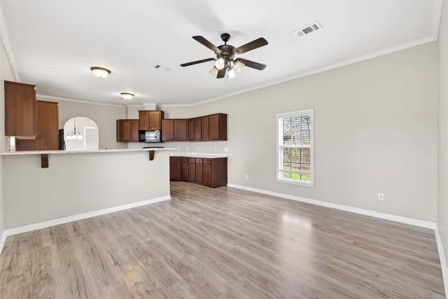a view of kitchen with wooden floor and window