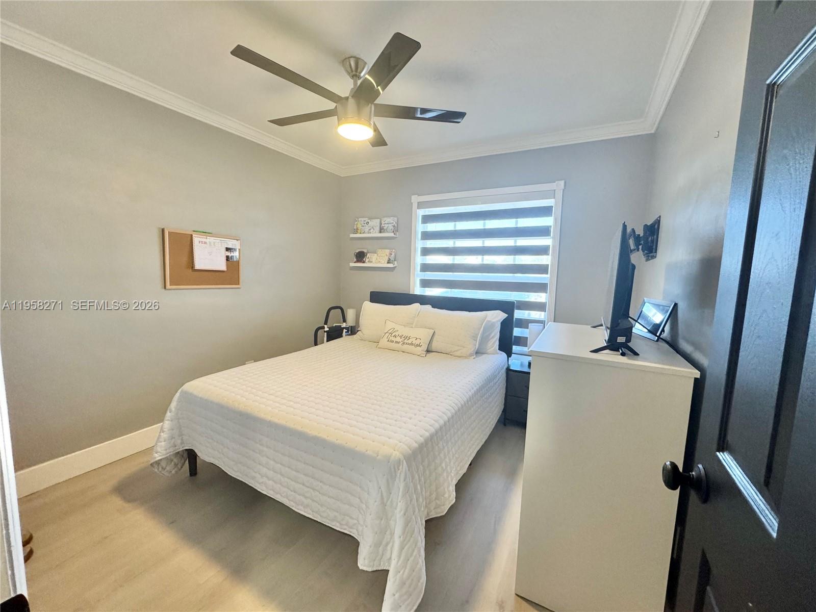 14849 Southwest 114th Court Miami, FL 33176 - Photo 11 of 23 a bed room with a bed and a window