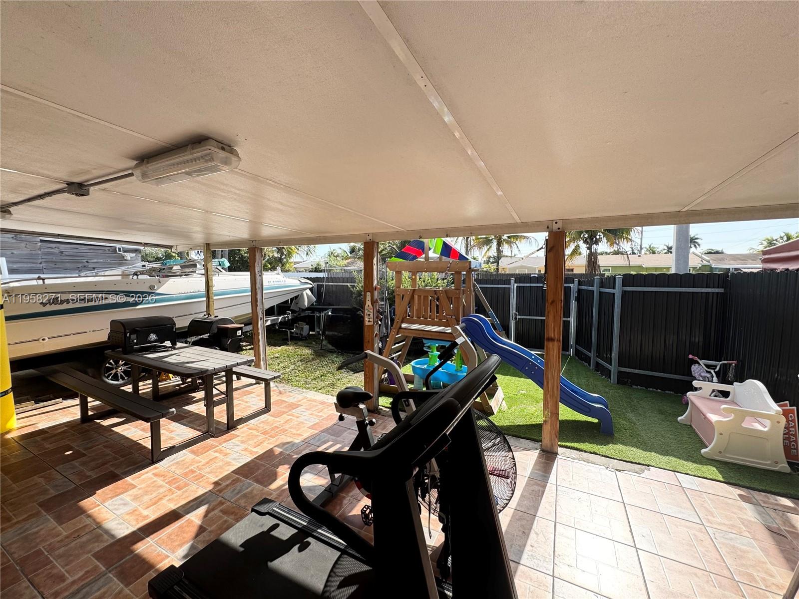14849 Southwest 114th Court Miami, FL 33176 - Photo 20 of 23 a view of a chairs and table in a patio