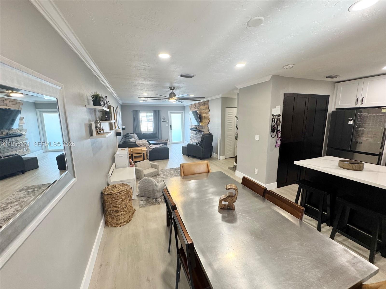 14849 Southwest 114th Court Miami, FL 33176 - Photo 6 of 23 a living room with lots of furniture and kitchen view