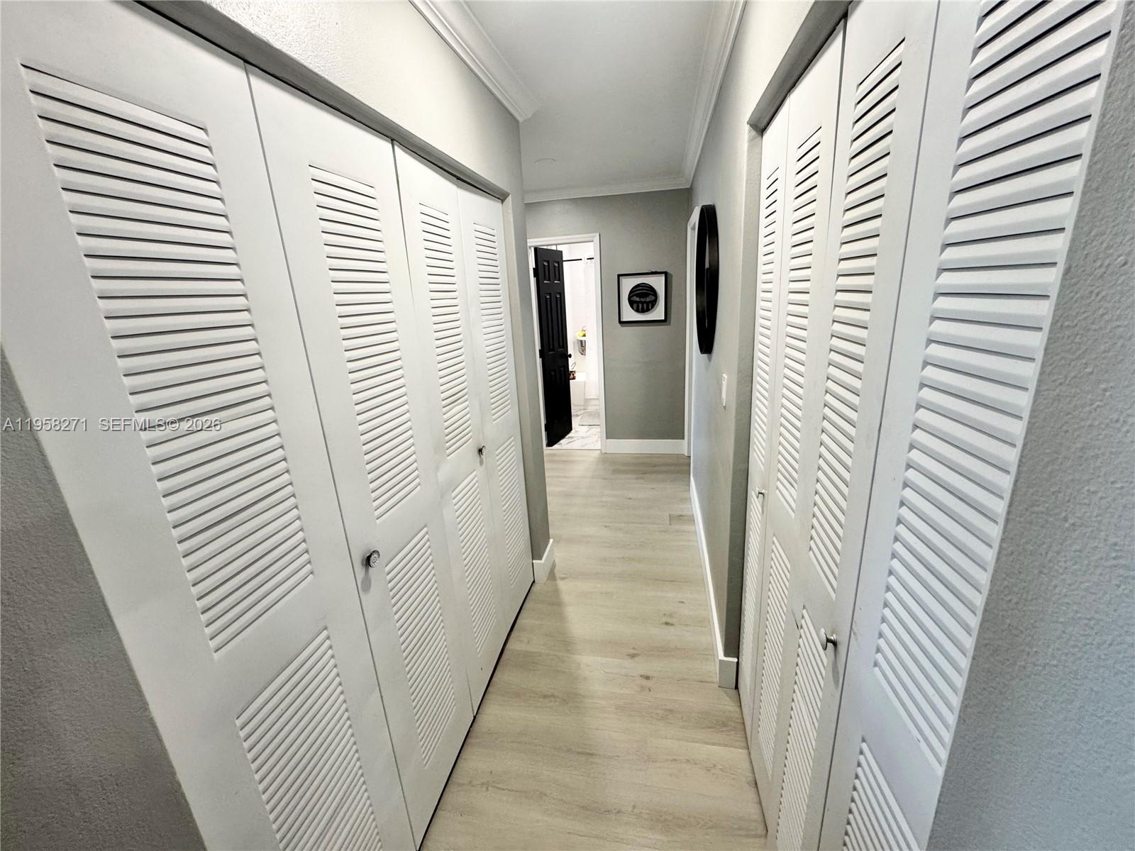 14849 Southwest 114th Court Miami, FL 33176 - Photo 9 of 23 a view of a bathroom from the hallway