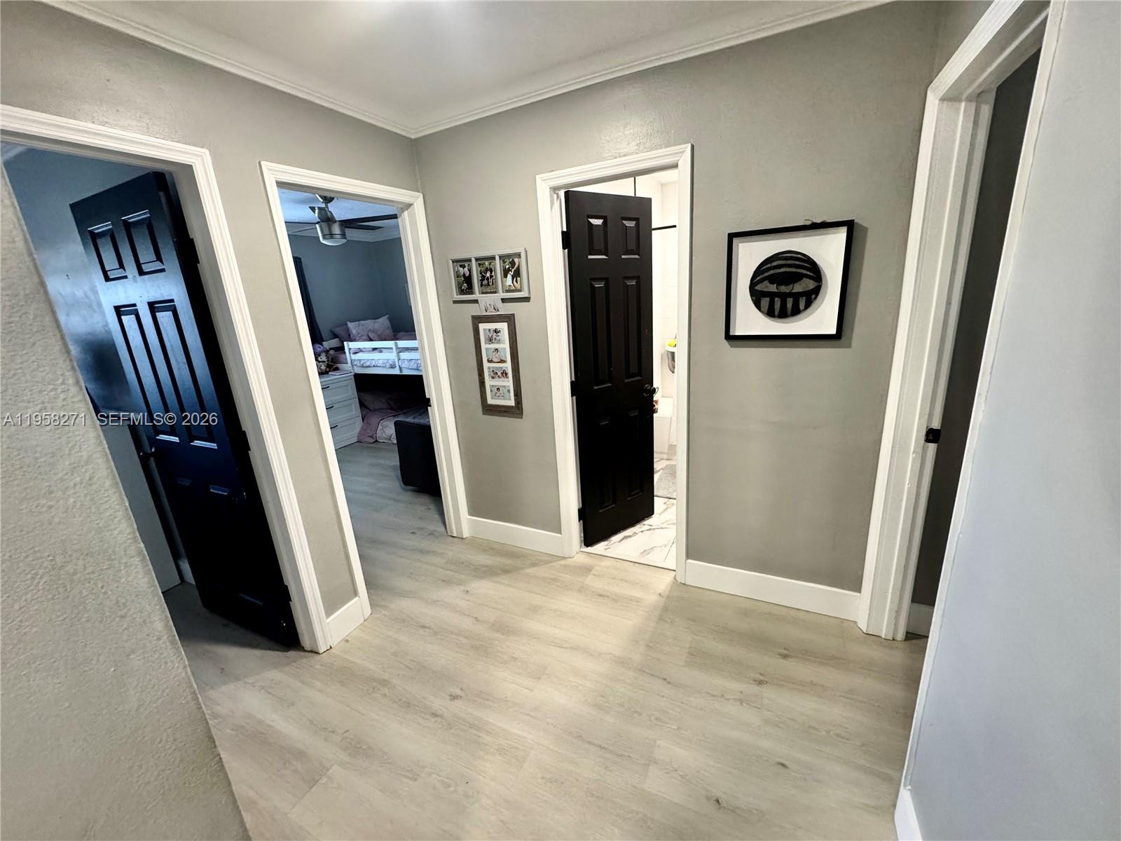 14849 Southwest 114th Court Miami, FL 33176 - Photo 10 of 23 a view of a hallway with wooden floor and closet