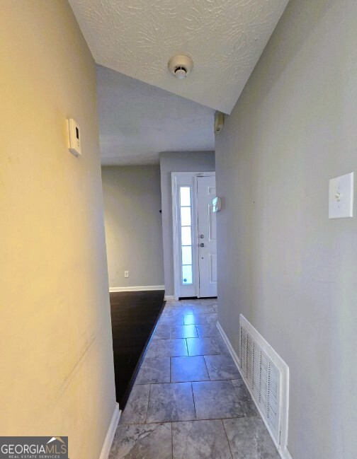 1674 Wynndowne Trail Smyrna, GA 30080 - Photo 2 of 15 a view of hallway with wooden floor