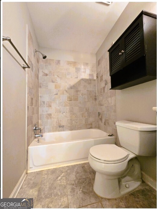 1674 Wynndowne Trail Smyrna, GA 30080 - Photo 9 of 15 a bathroom with a toilet a sink and a bathtub