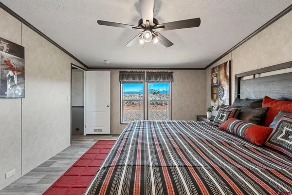 a bed room with a bed and a chandelier