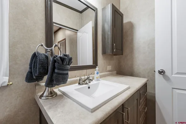 a bathroom with a sink and a mirror